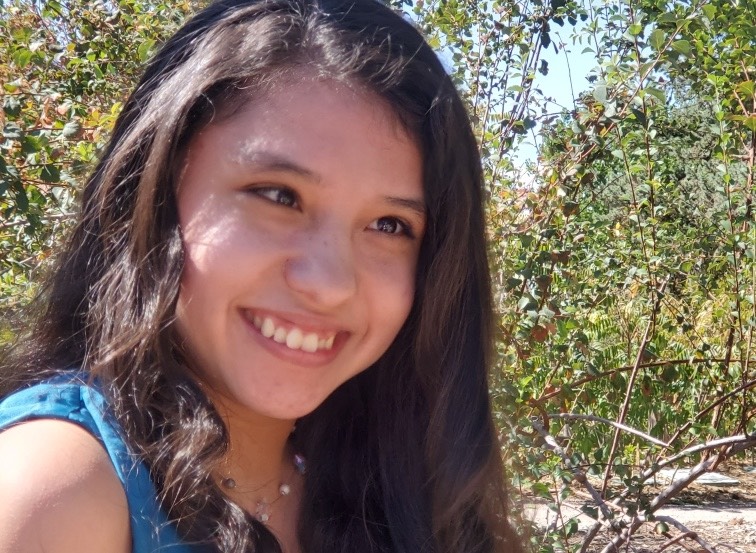 Girl in dark brown hair smiling