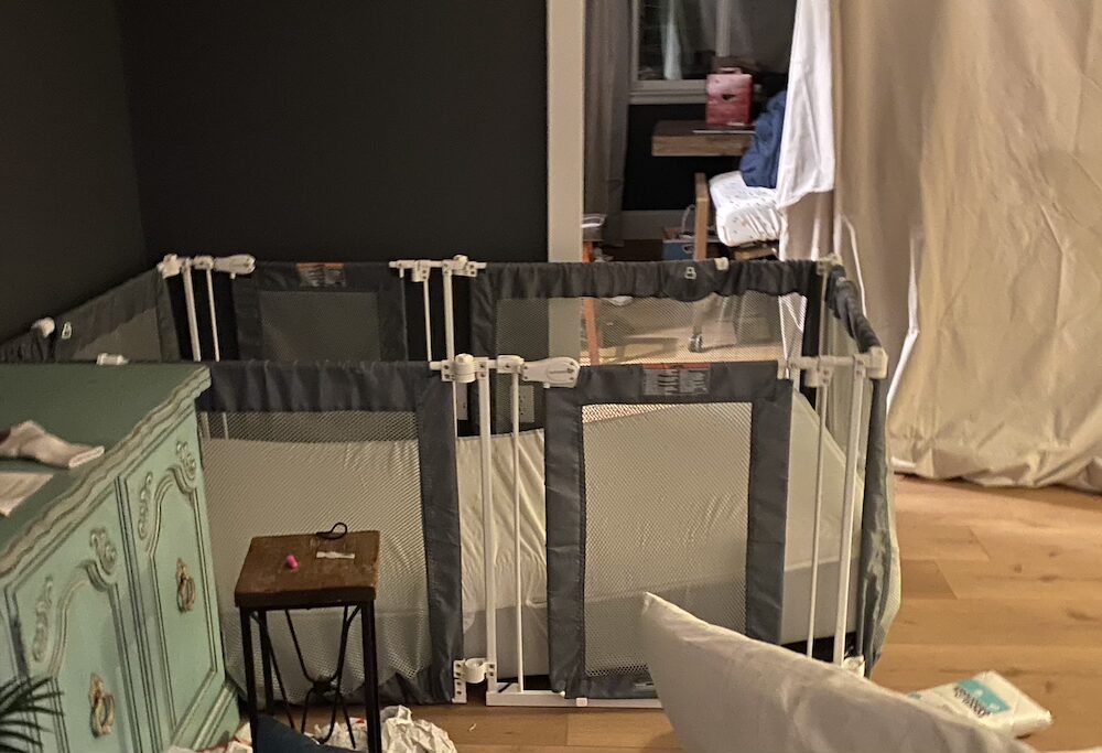 Summer baby gate with mattress for disability bed on wood floor