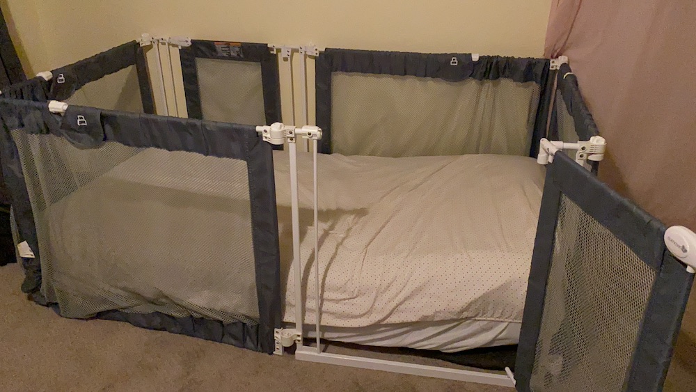 Summer baby gate with mattress inside